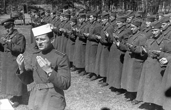 World war 2, yugoslavian military unit training in the soviet union, may 1944, islamic troops during morning prayers, being ministered by a mullah.
