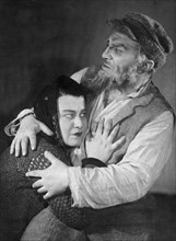 Solomon mikhoels in the title role in 'tevya the dairyman' by shalom aleichem, staged at the national jewish theater, ussr, may 1939, rotbaum is playing the role of tevya's daughter.