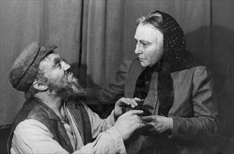 Solomon mikhoels in the title role in 'tevya the dairyman' by shalom aleichem, staged at the national jewish theater, ussr, february 1939, rom is playing the role of golda, tevya's wife.