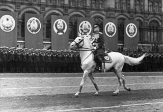 Marshal georgy zhukov riding across red square, reviewing the troops, prior to the victory parade on june 24, 1945.