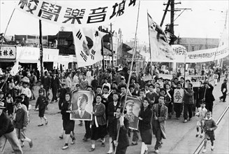 A demonstration in pyongyang, north korea held on the day when the returns of the elections to the people's committees were published, may 1947.