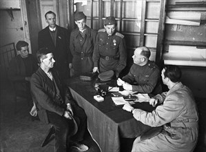Lieutenant-colonel ugryumov, military commandant of the central district of berlin, receiving visitors, 1945 or 1946.