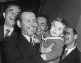 Albanian government delegation in moscow, april 1957, m, shehu, of the albanian delegation, holding little mircha techa, who's parents are students of the moscow university.