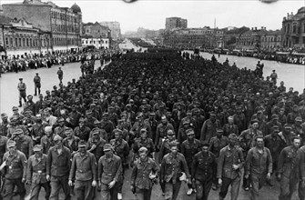 World war 2, 57,600 german soldiers, taken prisoner in the last few days by the troops of the 1st, 2nd, and 3rd belorussian fronts, being marched through the streets of moscow on their way to pow camp...