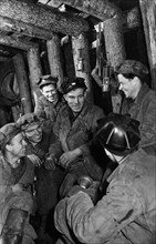 Vasili kochetov with fellow coal miners in a mine at the tula coal fields, ussr, 1930s.
