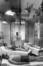 Soviet health resorts, workers undergoing quartz and sun-ray treatment in the light therapy room of the skala sanatorium at kislovodsk, may 1951.