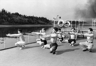 Soviet health resorts, morning exercises aboard a floating health spa for workers, july 1951.