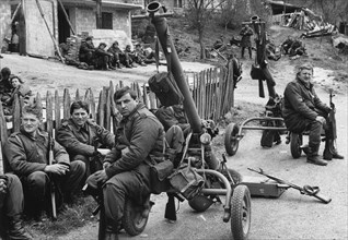 Yugoslav army reservists resting before entering bosnian town of visegrad, 170 km south of belgrade, war, 1992, yugoslavia.