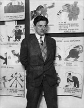 Vladimir mayakovsky, soviet poet, playwright and graphic artist (1894-1930) with some of his propaganda posters, this photo was taken two months before his death.