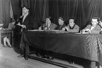 Rozaliya zemlyachka (seated with glasses) during a purge trial at a co-operative in moscow, 1933, a leading bolshevik party member, she was one of the organizers of the 'red terror' during the civil w...