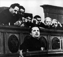 Bolshevik leader sergei mironovich kirov speaking at the 17th congress of the all-union communist party of bolsheviks in february 1934, ordzhonikidze is behind him on the left.