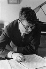Soviet composer, dmitri shostakovich, working in his study, 1938.