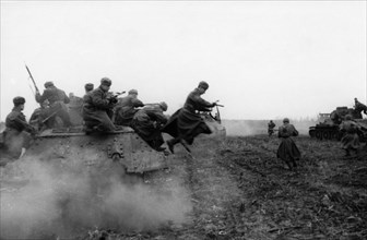 World war 2, 2nd ukrainian front, tank-borne soviet infantry attacking on the approaches to budapest, hungary, december 1944.