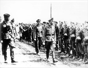 Heinrich himmler reviews the guard of honour during his visit to the ss 'viking' division in september 1942.
