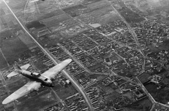 World war 2, 3rd ukrainian front, a soviet shturmovik plane flying over the city during the battle for budapest, january 1945.