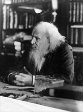 Dimitri ivanovich mendeleev, 1834 - 1907, the famous russian chemist in his study.