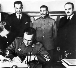 Tito (seated), stalin and molotov (far right) at the signing ceremony of the yugoslavia and ussr friendship treaty in apr, 1945.