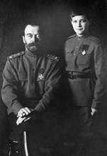 A portrait of tsar nicholas ll with his son alexei wearing military uniforms in 1915.