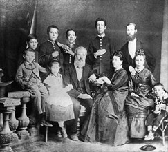 Chekhov family portrait, in the center, sitting, are the parents,pavel and yevgenia chekhov, on the left are mikhail and maria, on the right is aunt lyudmila with her son georgy, standing (from left) ...