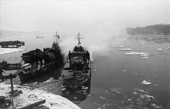 World war 2, soviet armored cutters 'stalinets' and 'hero of the soviet union golubets' of the soviet danube military flotilla moored at the hungarian bank of the danube river, february 1945.