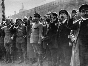 A parade in red square, moscow, soviet union, may 1st, 1922, left to right: mikhail lashevich (second from left), leon trotsky (center, military uniform, beard), lev kamenev (second from right), tomsk...