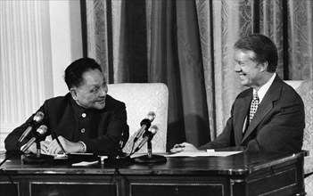 Chinese vice-premier deng xiaoping and us president jimmy carter during the signing of the us/china scientific and technological cooperation agreement and a cultural agreement at the white house on ja...