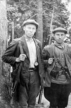 Members of a guerrilla detachment which successfully operates in nazi rear.