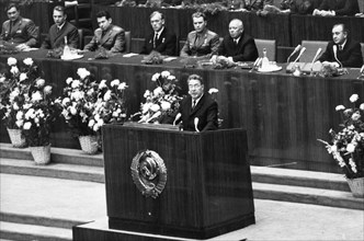 Leonid brezhnev speaking at a meeting in the kremlin palace in honor of all those who participated in the success of the soyuz 6, soyuz 7, and soyuz 8 space missions, october 22, 1969.