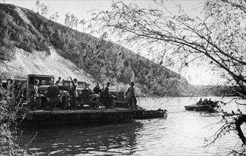 The southern front, a pontonier unit carrying ammunition, fuel, and food, crossing the river 'n' in close proximity to the front, may 1942.