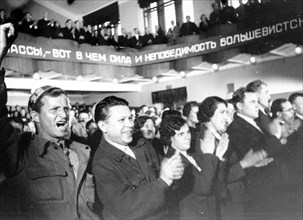 Factory workers' meeting to discuss the first election to the supreme soviet of the ussr, 1937.