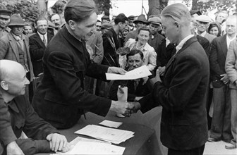 Latvian peasant, j, karklin receiving a deed entitling him to free and permanent holdings of land, july 1945.