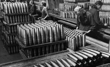 Civilian women making artillery shells at a munitions factory in siberia during world war 2, june 1942.