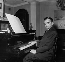 Composer dimitri shostakovich at his piano at home, early 1950s.