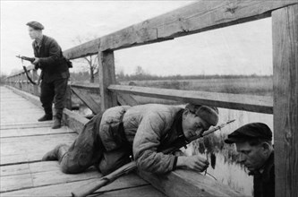Partisans mining a bridge in western byelorussia, world war 2.