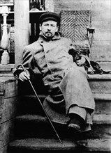 Anton chekhov, russian author, with his dachshund quinine, may 1897, at melikhovo, the chekhov estate.