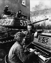World war 2, a member of a soviet tank crew playing piano at the end of the war (berlin?), 1945.