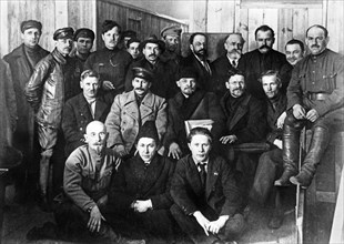 V,i, lenin, m,i, kalinin, i,v, stalin in a group of delegates of the 8th meeting of the bolshevik communist party in moscow, march 1919.