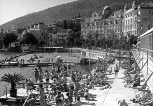 Popular beach of opatija on the adriatic coast, yugoslavia, mid 1960s.