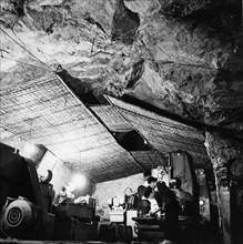 An auto repair shop in a cave near thank hao along the ho chi minh trail, vietnam war, 1968.