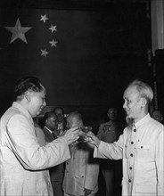 Chairman mao zedong and president ho chi minh of the democratic republic of vietnam toast the signing of the joint communique between their countries, june 1955, peking (beijing), china.