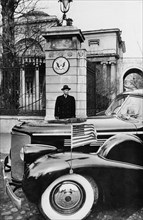 Us ambassador to the soviet union, walter b, smith, about to enter his car in front of spasso house, the residence of american ambassadors in moscow, ussr, late 1940s.