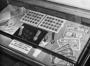 Trial of u2 spy plane pilot francis gary powers, moscow, ussr, 1960, exhibition of wreckage of downed american spy plane, case containing money, watches, rings 'with which powers was to bribe soviet p...