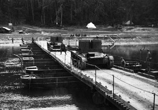 Soviet t-26a light tanks crossing a pontoon bridge during training exercises, 1939.