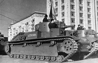 A soviet tank named after stalin during a military parade, 1930s.
