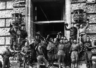 Soviet red army soldiers celebrating outside the reichstag (chancery) building, fall of berlin, may 1945, world war 2.