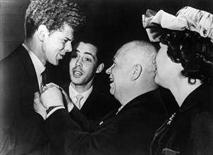 Nikita khrushchev congratulating van cliburn for winning the first prize during the closing ceremonies of the tchaikovsky international violin and piano competition, april 14, 1958, us ambassador thom...