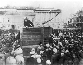 V,i, lenin speaking to red army troops leaving for the front (civil war period), sverdlov square, moscow, may 5th 1920, this is an altered image: the figure of leon trotsky standing in the area with s...