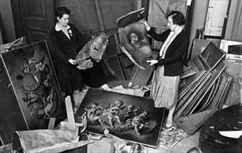 Museum workers at the hermitage museum in leningrad work to save the priceless art treasures damaged by nazi shelling of the building, seige of leningrad, world war 2.