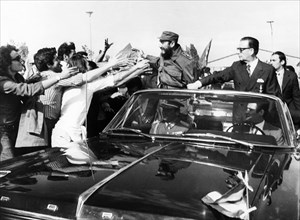 Fidel castro of cuba with president salvador allende being greeted by chilean students upon his arrival at pudahuel airport in santiago on november 10, 1971.