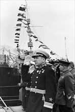Commander of the baltic fleet, vice-admiral v,f, tributs at the hoisting of the flag on one of the soviet warships, may 1941.